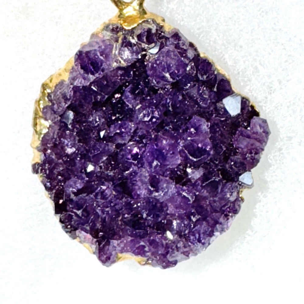 Striking Amethyst pendant gold plated on purple crystal Necklace.